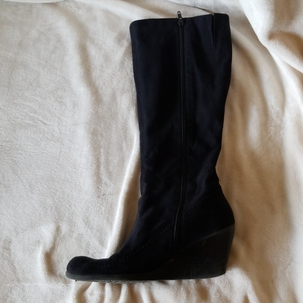 Heeled knee high boot